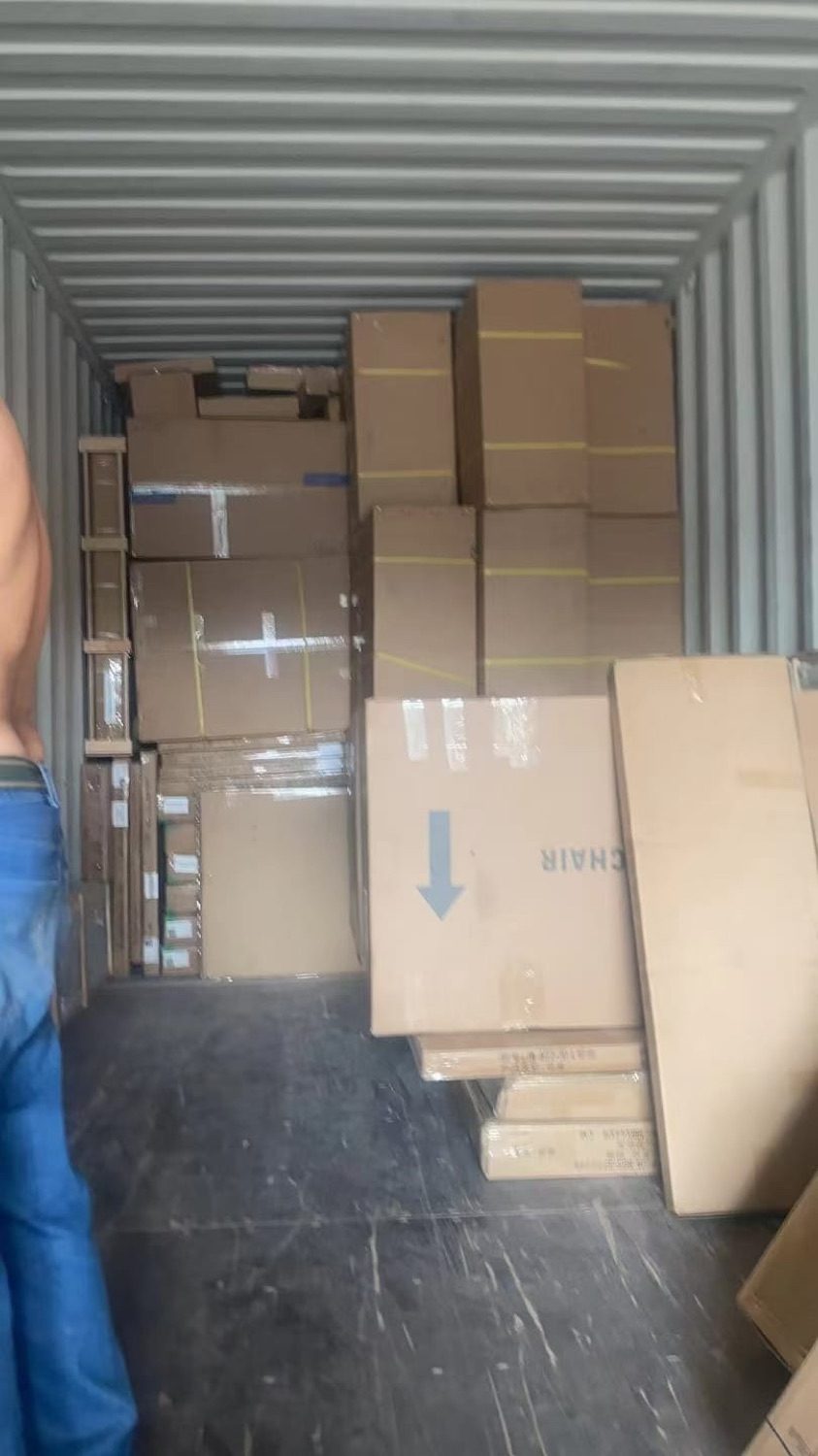 Mixed cartons stacked and secured in the container