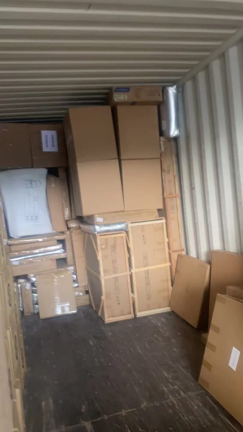 Boxes and bagged goods loaded for door-to-door delivery
